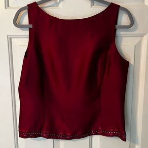 Two piece burgundy silk pantsuit. Top is size 10. Pants are size 6